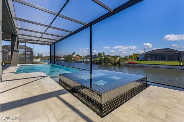 view of swimming pool featuring a lanai, a patio, a water view, and a pool with connected hot tub