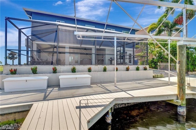 exterior space featuring a wooden deck and a lanai