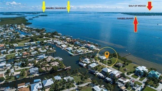 aerial view featuring a water view and a residential view