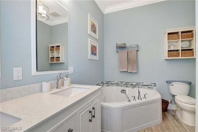 full bath featuring crown molding, vanity, toilet, wood finished floors, and a bath