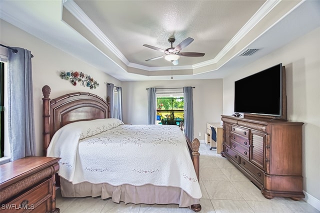 bedroom featuring crown molding, visible vents, light tile patterned floors, and a raised ceiling