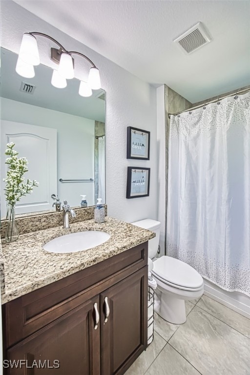 full bath with toilet, visible vents, marble finish floor, and vanity