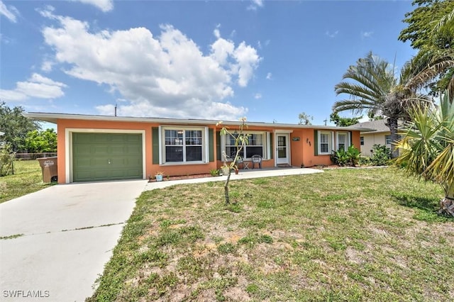ranch-style house with an attached garage, driveway, stucco siding, and a front yard