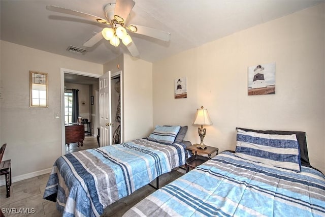 bedroom with visible vents, a ceiling fan, and baseboards