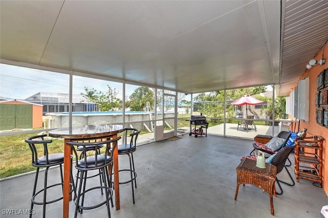 sunroom / solarium with outdoor dining space
