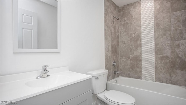 full bath featuring toilet, bathing tub / shower combination, and vanity