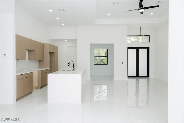 kitchen featuring a sink, modern cabinets, recessed lighting, and light tile patterned flooring