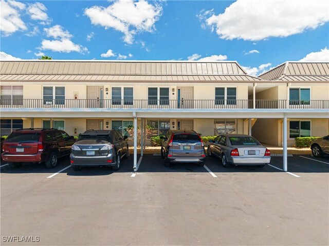 4211 SE 19th Pl Unit 1C, Cape Coral, FL 33904 - view of building exterior featuring covered parking