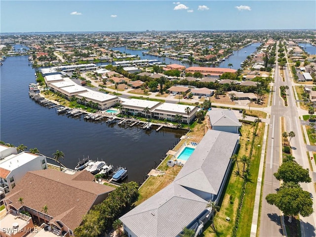 aerial view with a water view and a residential view