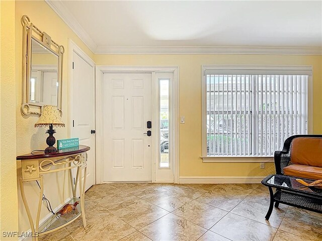 4211 SE 19th Pl Unit 1C, Cape Coral, FL 33904 - foyer entrance featuring ornamental molding, baseboards, and light tile patterned floors