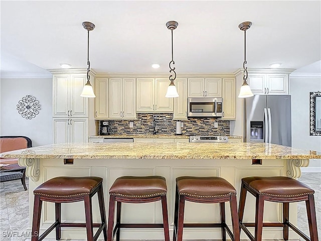 kitchen with backsplash, cream cabinetry, and stainless steel appliances