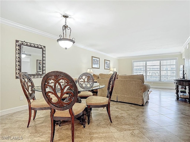 dining area with baseboards and ornamental molding