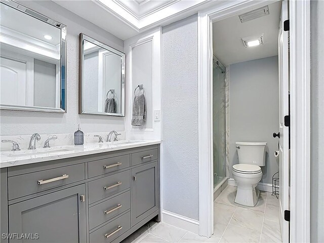 4211 SE 19th Pl Unit 1C, Cape Coral, FL 33904 - bathroom with toilet, double vanity, a shower stall, marble finish floors, and baseboards