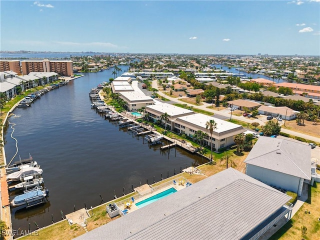 bird's eye view featuring a water view and a residential view