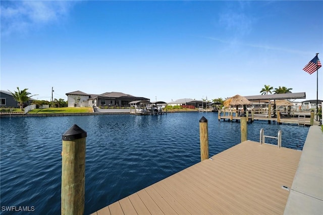 dock area with a water view and a residential view
