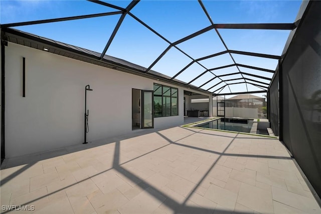 view of patio with an outdoor pool, a lanai, and a jacuzzi