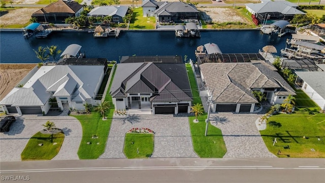 birds eye view of property featuring a residential view and a water view