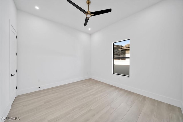 spare room with a ceiling fan, baseboards, recessed lighting, and light wood-type flooring