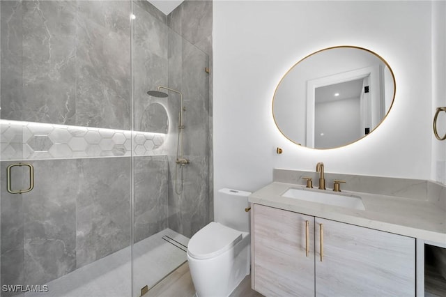 bathroom featuring toilet, walk in shower, and vanity