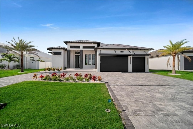 3617 Embers Pkwy W, Cape Coral, FL 33993 - prairie-style house featuring decorative driveway, a garage, a standing seam roof, stucco siding, and metal roof