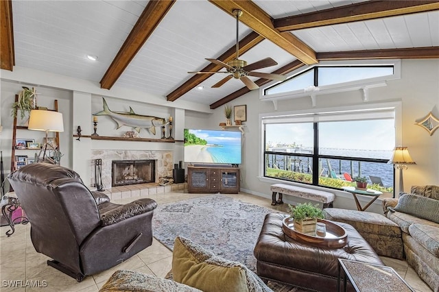 living area featuring a fireplace, ceiling fan, light tile patterned floors, and wood ceiling