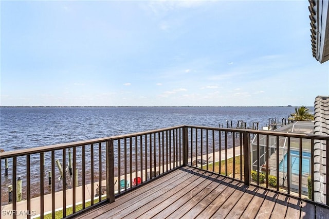 wooden deck with a water view