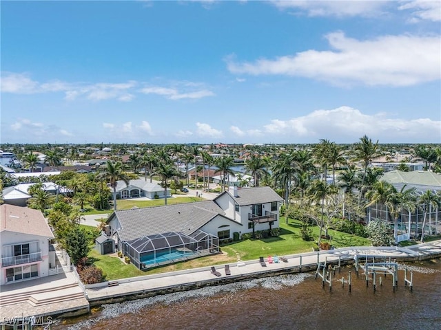 aerial perspective of suburban area with a large body of water
