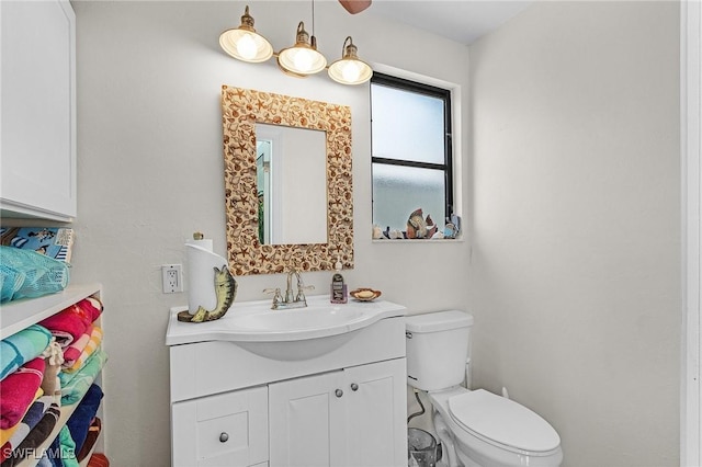 bathroom featuring toilet and vanity