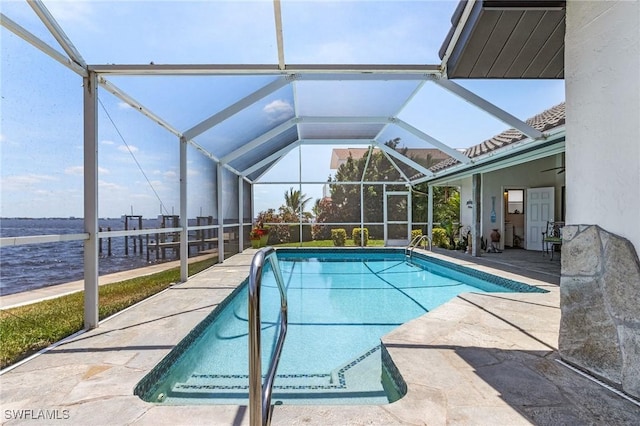 swimming pool featuring a patio area and glass enclosure
