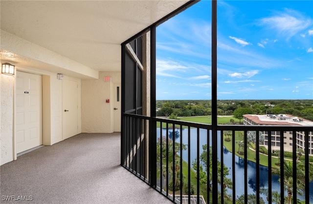 balcony featuring a water view