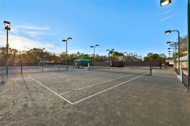 view of sport court featuring fence