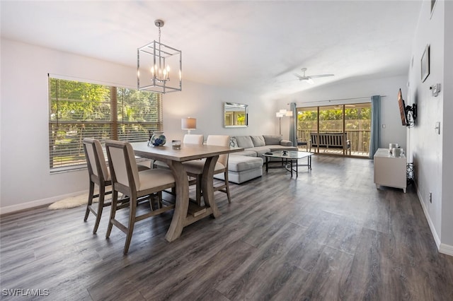 dining room with baseboards, a chandelier, and dark wood-style floors