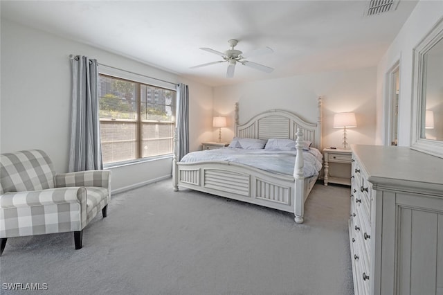 bedroom featuring baseboards, a ceiling fan, light colored carpet, and visible vents