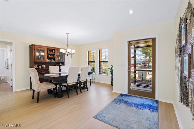 713 SW 39th Ter, Cape Coral, FL 33914 - dining room with light wood-style floors, recessed lighting, baseboards, and a chandelier
