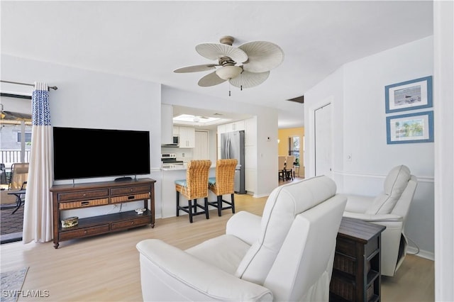 713 SW 39th Ter, Cape Coral, FL 33914 - living area featuring a ceiling fan and light wood-style flooring