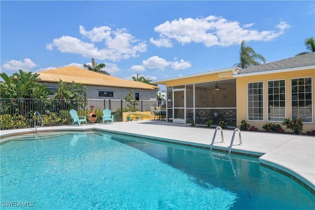 713 SW 39th Ter, Cape Coral, FL 33914 - view of swimming pool with a sunroom, fence, a patio area, and a fenced in pool