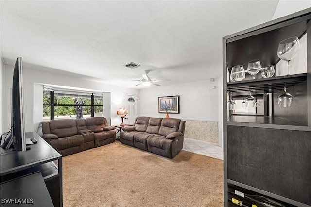 326 Mcarthur Ave, Lehigh Acres, FL 33936 - carpeted living room featuring a ceiling fan and tile patterned floors