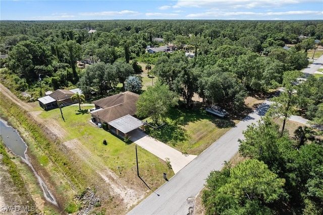 326 Mcarthur Ave, Lehigh Acres, FL 33936 - drone / aerial view of a heavily wooded area