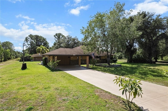 326 Mcarthur Ave, Lehigh Acres, FL 33936 - view of front facade with driveway, a front lawn, an attached garage, and a carport