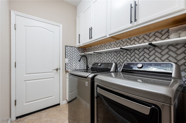 2094 Satsuma Ln, Naples, FL 34120 - laundry room with washer and dryer and cabinet space