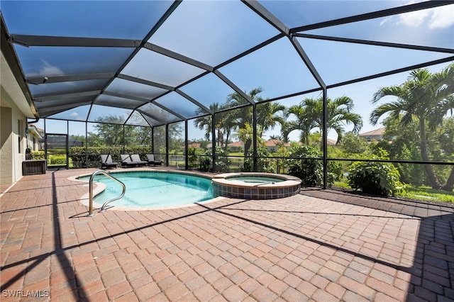 2094 Satsuma Ln, Naples, FL 34120 - view of pool featuring a pool with connected hot tub, a patio, and glass enclosure