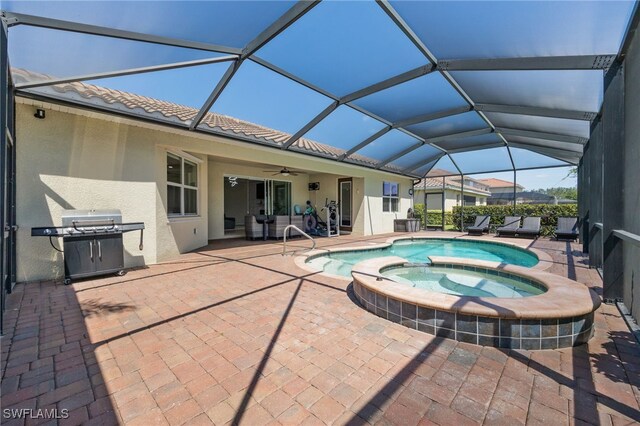 2094 Satsuma Ln, Naples, FL 34120 - view of pool featuring ceiling fan, a patio, area for grilling, a pool with connected hot tub, and a lanai