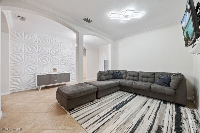 2094 Satsuma Ln, Naples, FL 34120 - tiled living area featuring arched walkways, ornamental molding, and baseboards