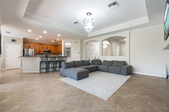 2094 Satsuma Ln, Naples, FL 34120 - living area with a raised ceiling, ornamental molding, arched walkways, baseboards, and recessed lighting