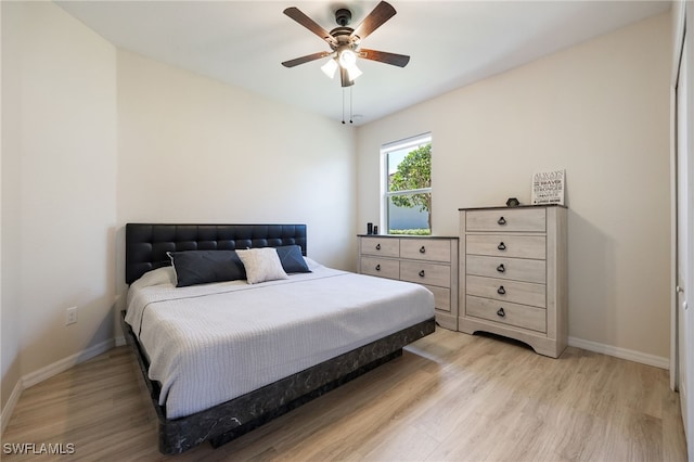 2094 Satsuma Ln, Naples, FL 34120 - bedroom featuring light wood-style flooring, baseboards, and ceiling fan