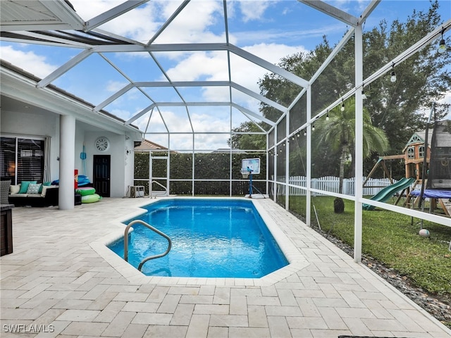 pool with a patio, a fenced backyard, an outdoor living space, a lanai, and a yard