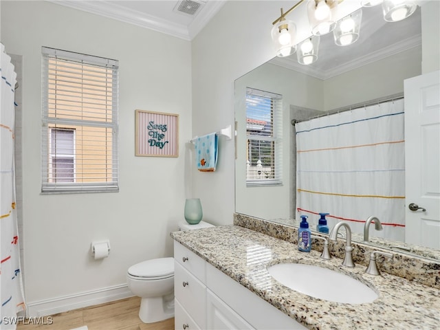full bathroom featuring crown molding, vanity, baseboards, wood finished floors, and visible vents