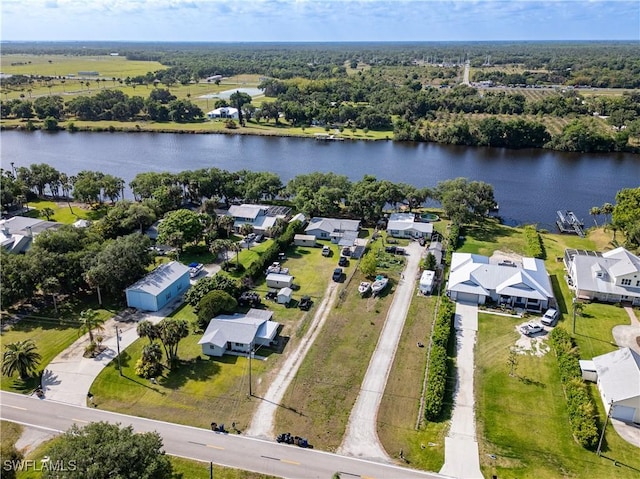 bird's eye view with a water view and a residential view