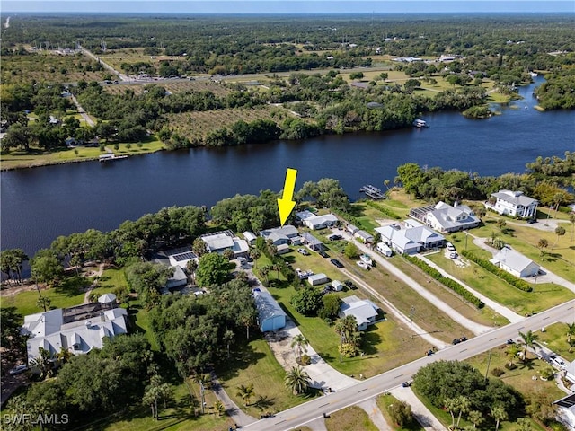 drone / aerial view featuring a water view and a residential view