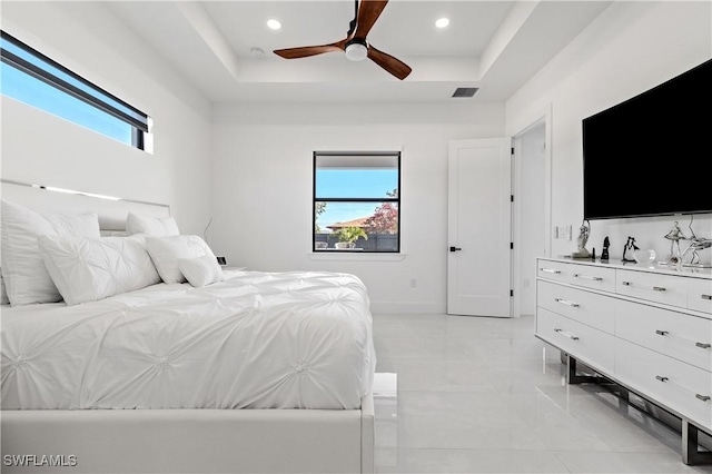 bedroom with visible vents, recessed lighting, ceiling fan, and a tray ceiling